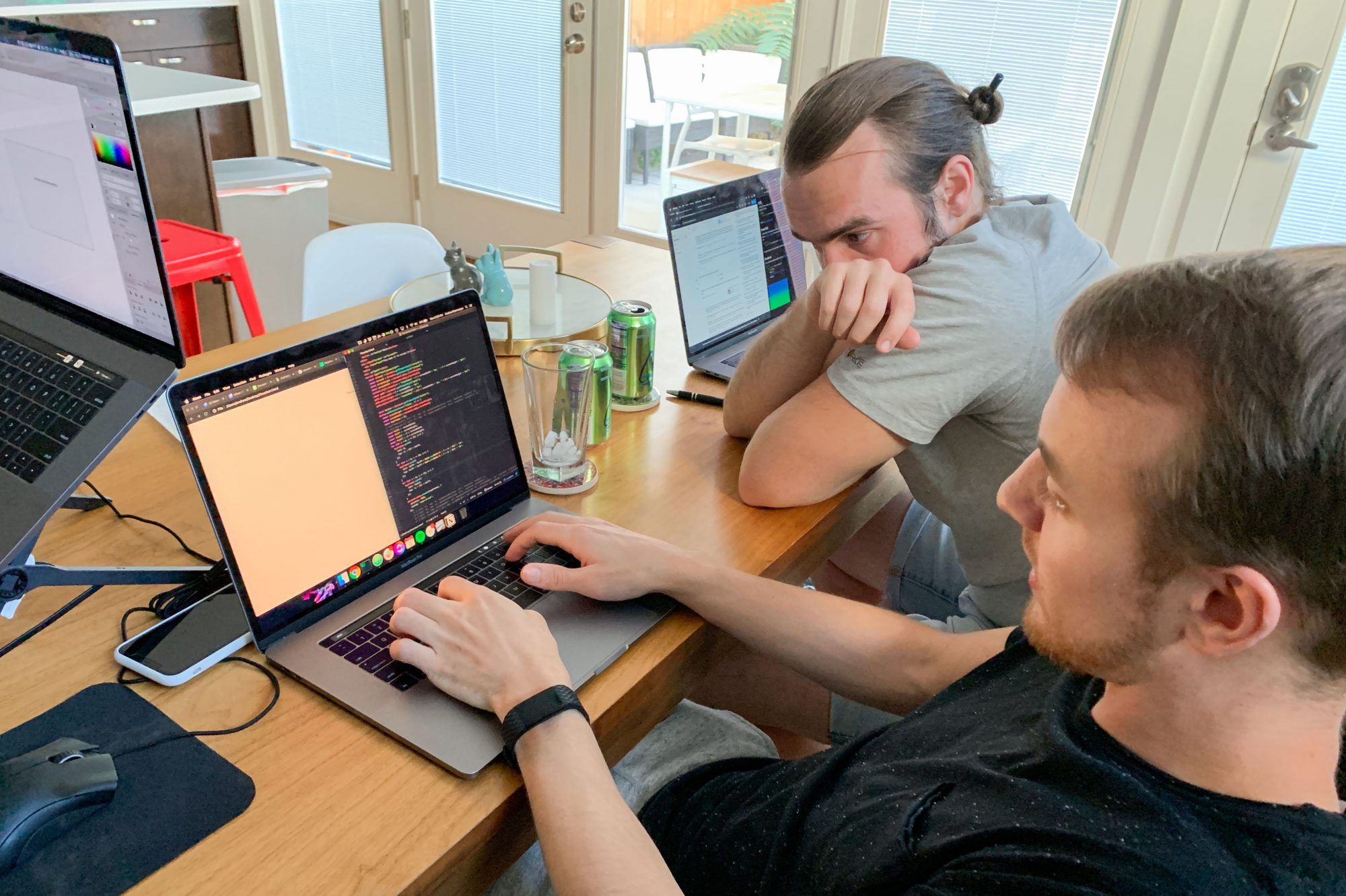 A photo of Canny's two team members hacking in Denver