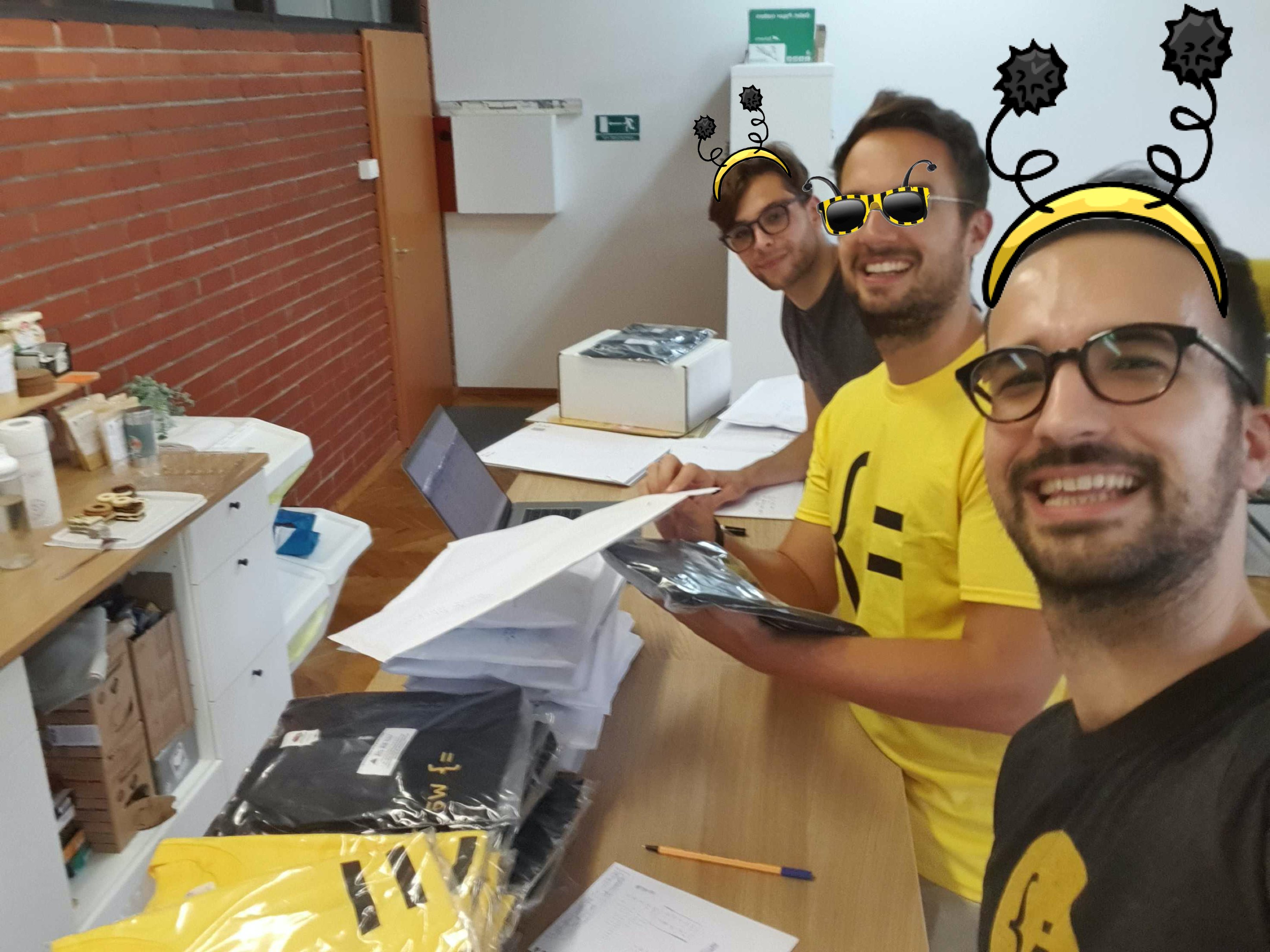 A photo of Wasp's team packing t-shirts for users
